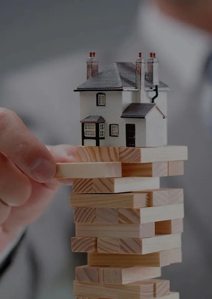 jenga blocks with a house on top
