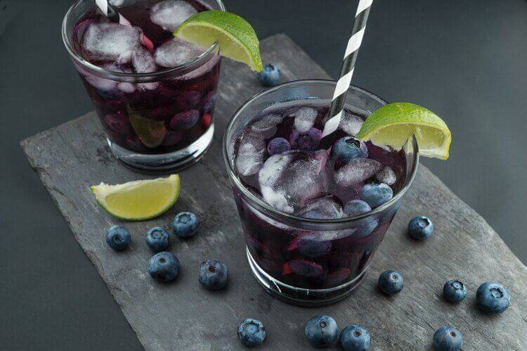 Corporate Photography showing food phtoography of 2 blueberry drinks on a slate plate