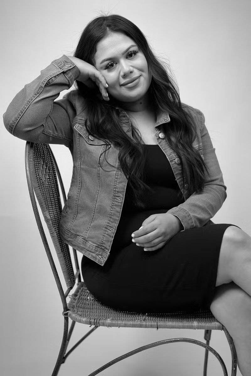 Ashley, A black and white photo of a female photographer from Candid Studios, photography and videography
