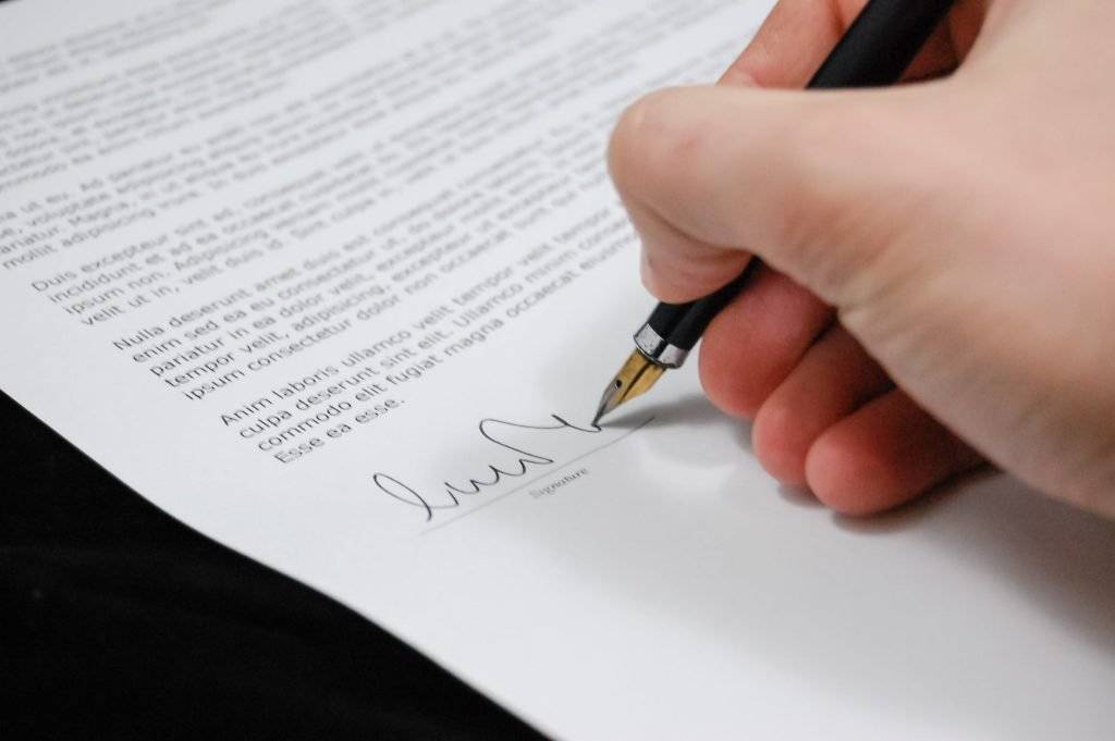 Someone signing a legal contract